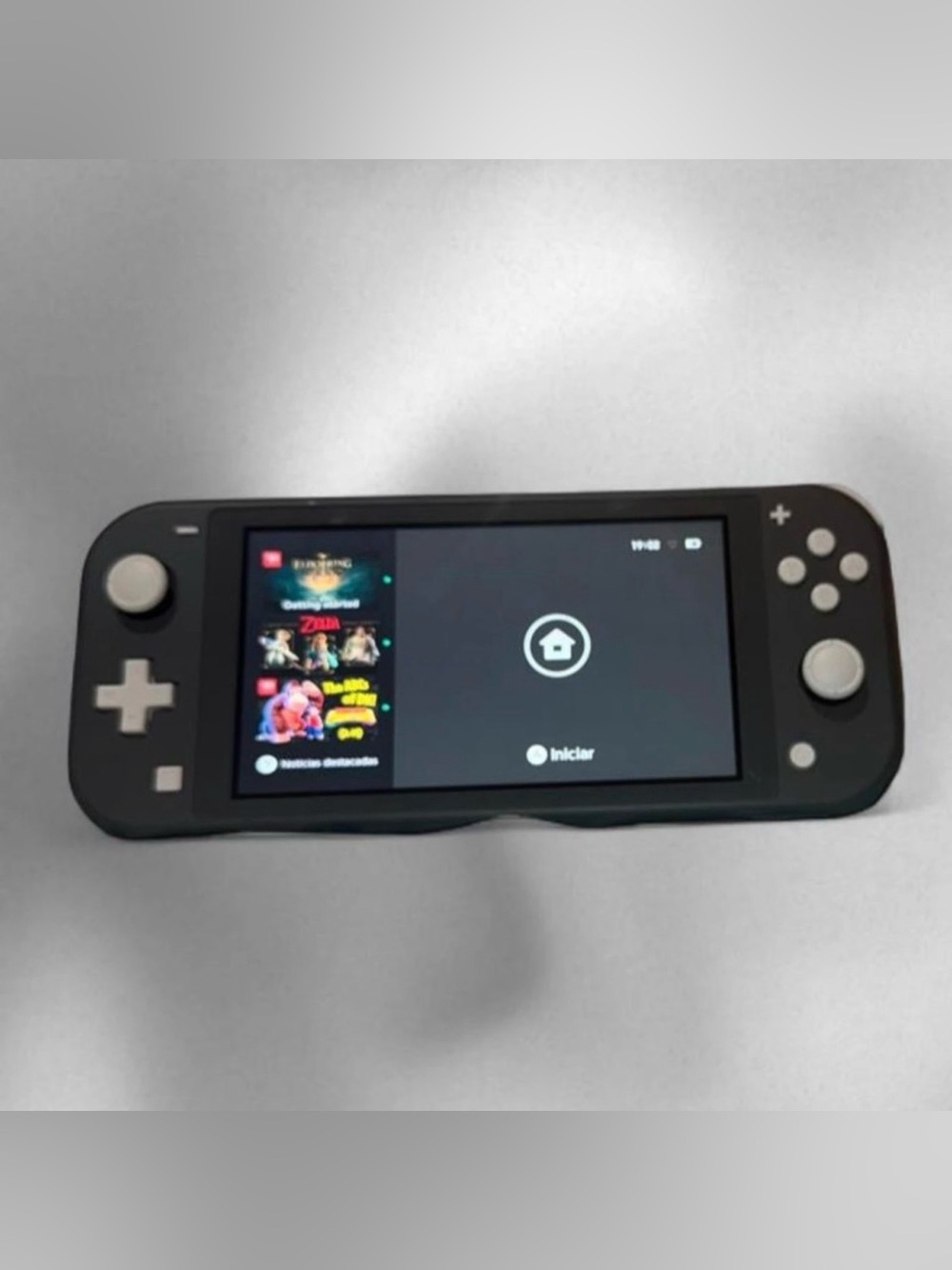 Nintendo Switch Lite with Tomodachi Life and Pokémon Legends.